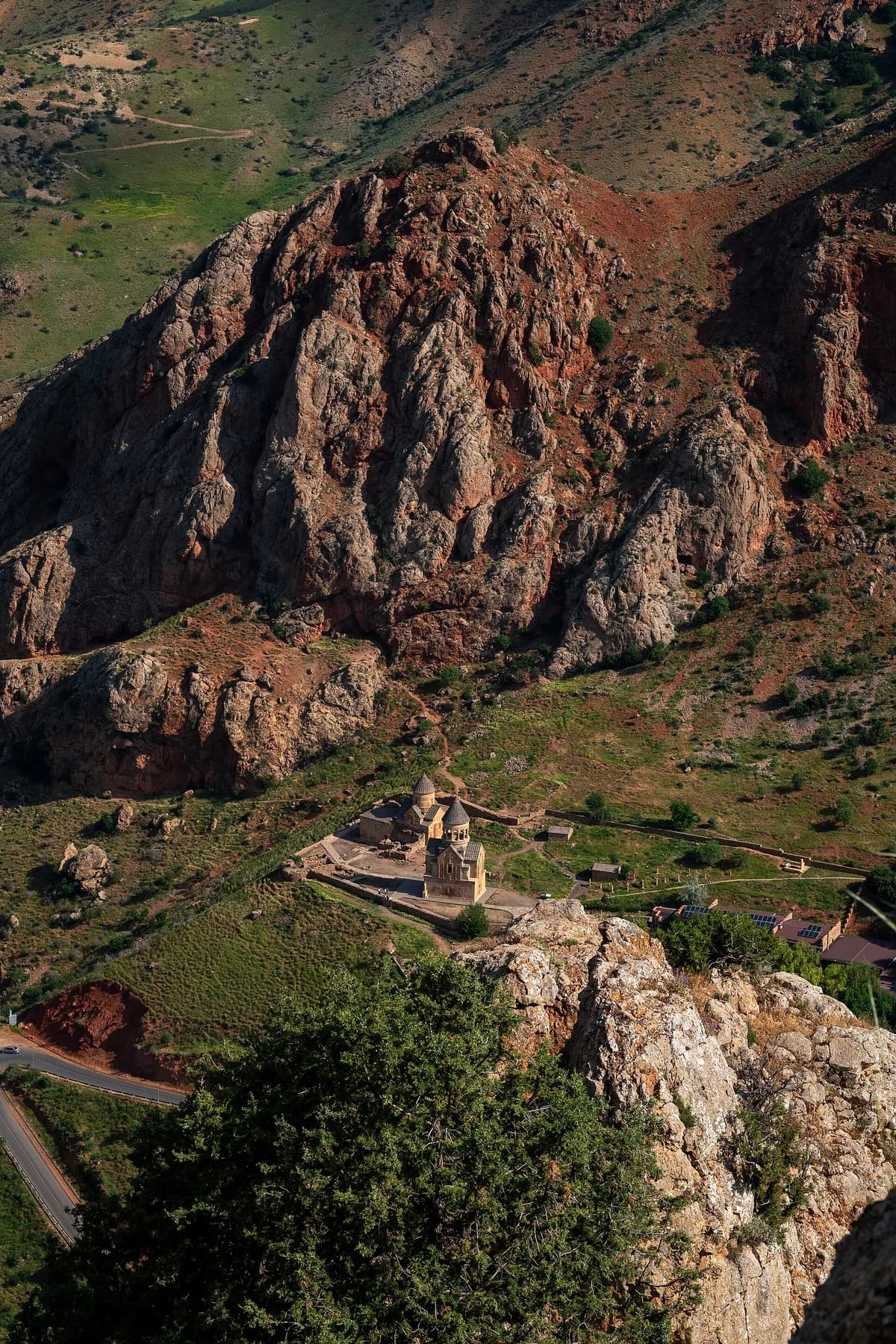 Noravank Monastery beneath the red and gray cliffs of the Amaghu gorge in Vayots Dzor