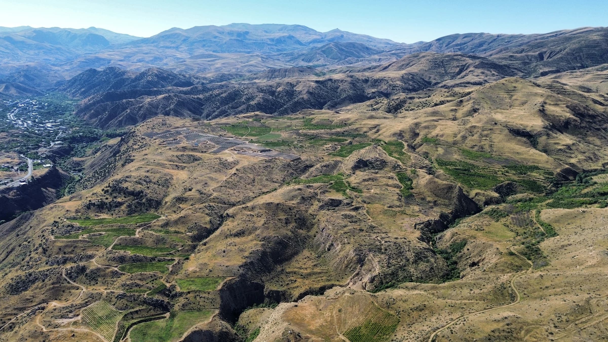 Drone view of Vayk Winery’s vineyards, the Arpa Valley and Vayk in the distance, 2024
